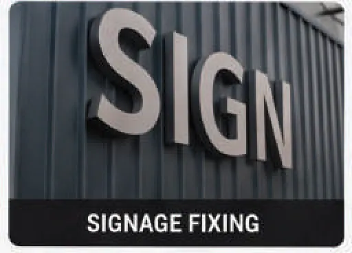 Signage lettering mounted on a metal clad wall