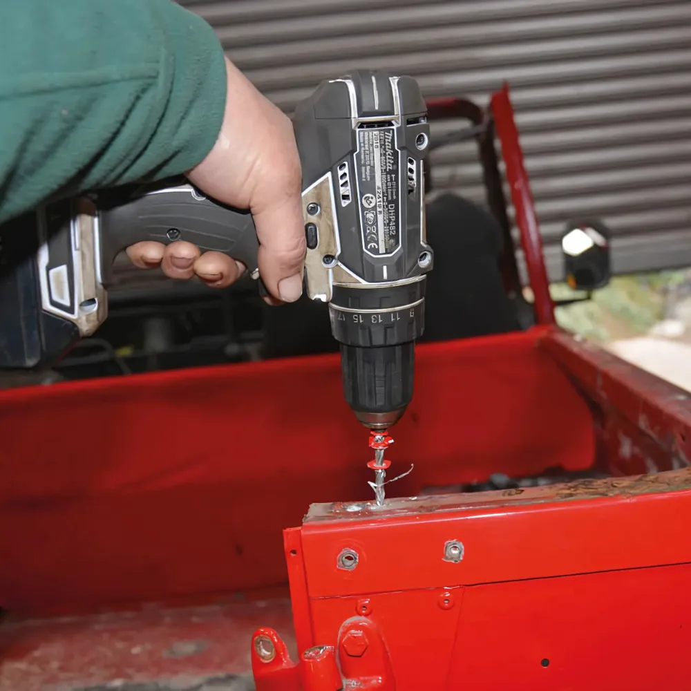 Blind rivets being set with a rivet gun in a sheet metal fabrication assembly