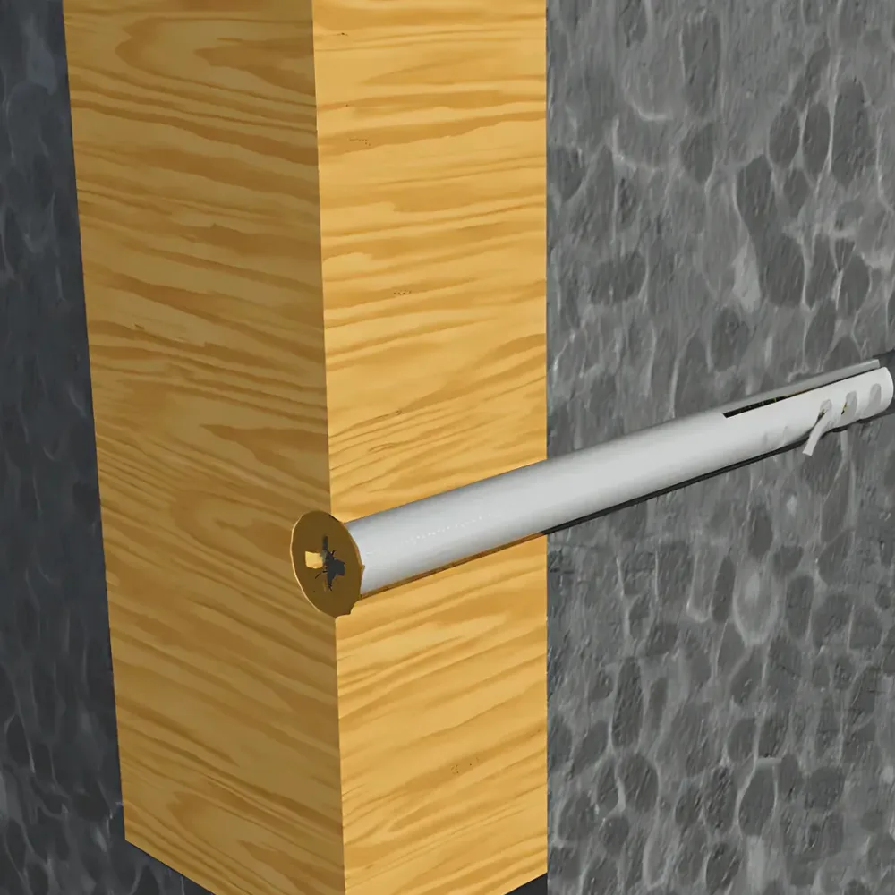 A nylon frame fixing installed through a timber frame into a masonry wall