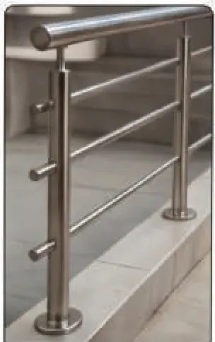 Stainless handrail posts fixed into concrete stair treads